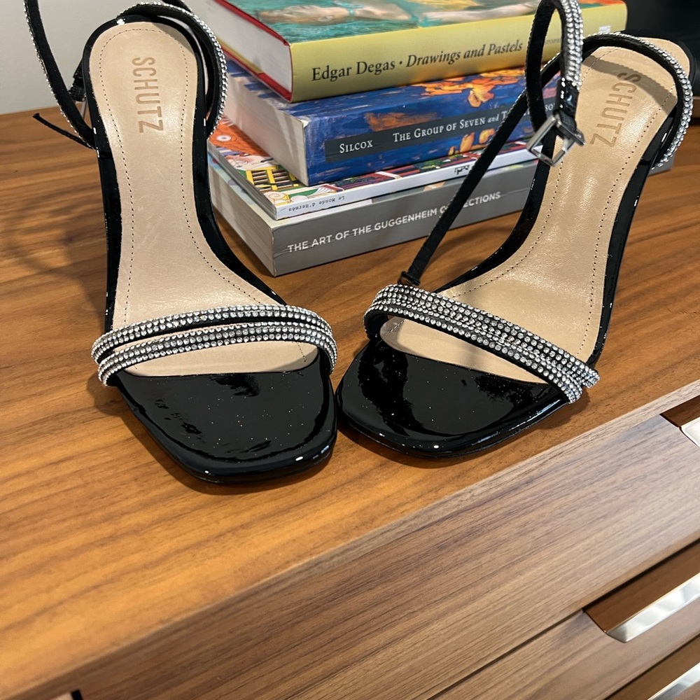 Only worn inside black patent rhinestone straps sandals